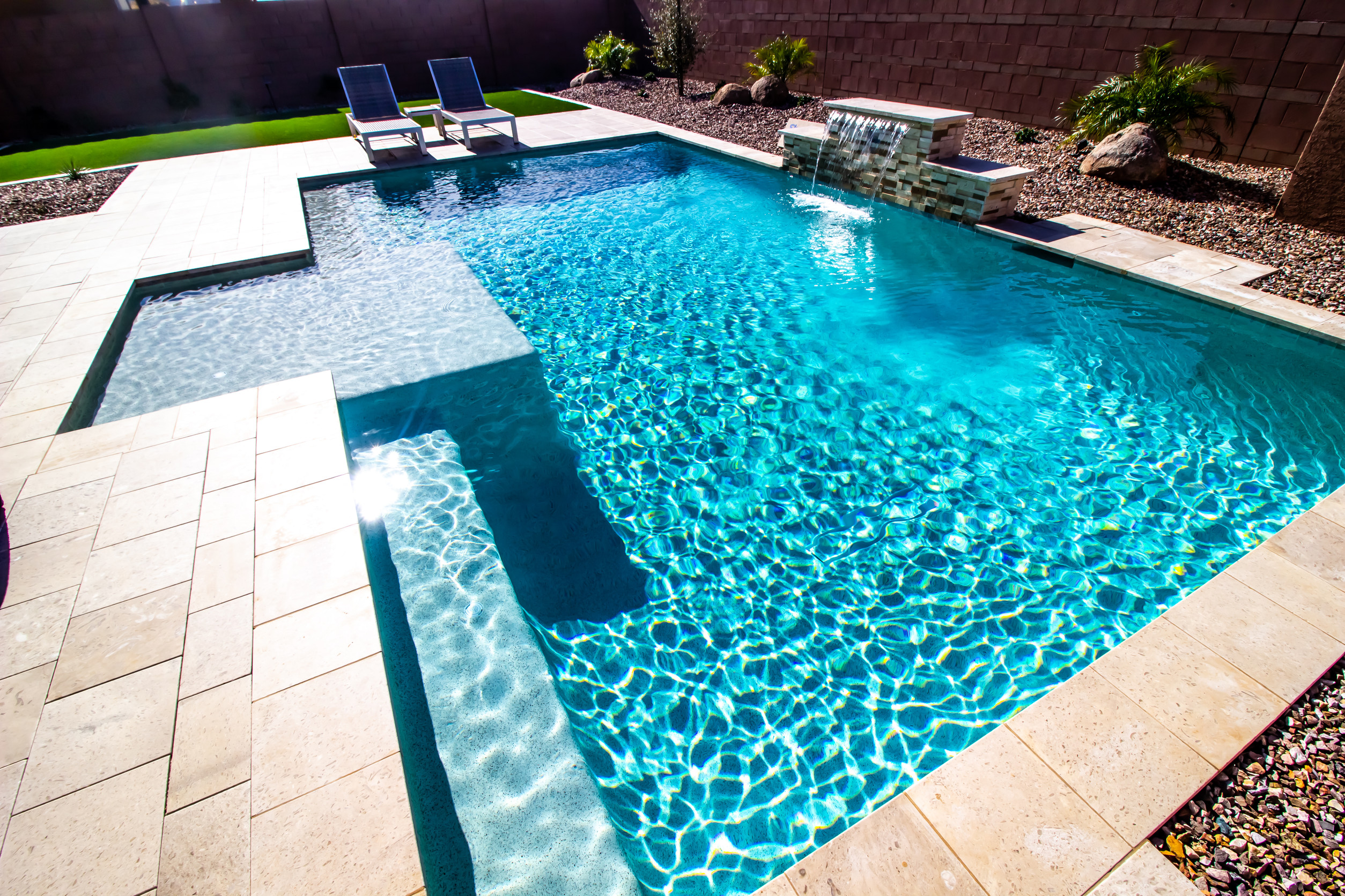 Custom gunite swimming pool with tile coping by Lorett's Remodeling and Construction in Tulsa, OK